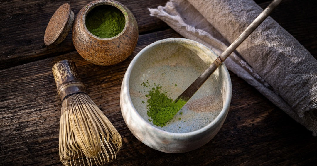 Matcha, green tea powder, matcha container, natsume, bamboo scoop and whisk, chashaku, chasen, pottery tea bowl, chawan, tea cloth, fukusa, chakin, wooden table