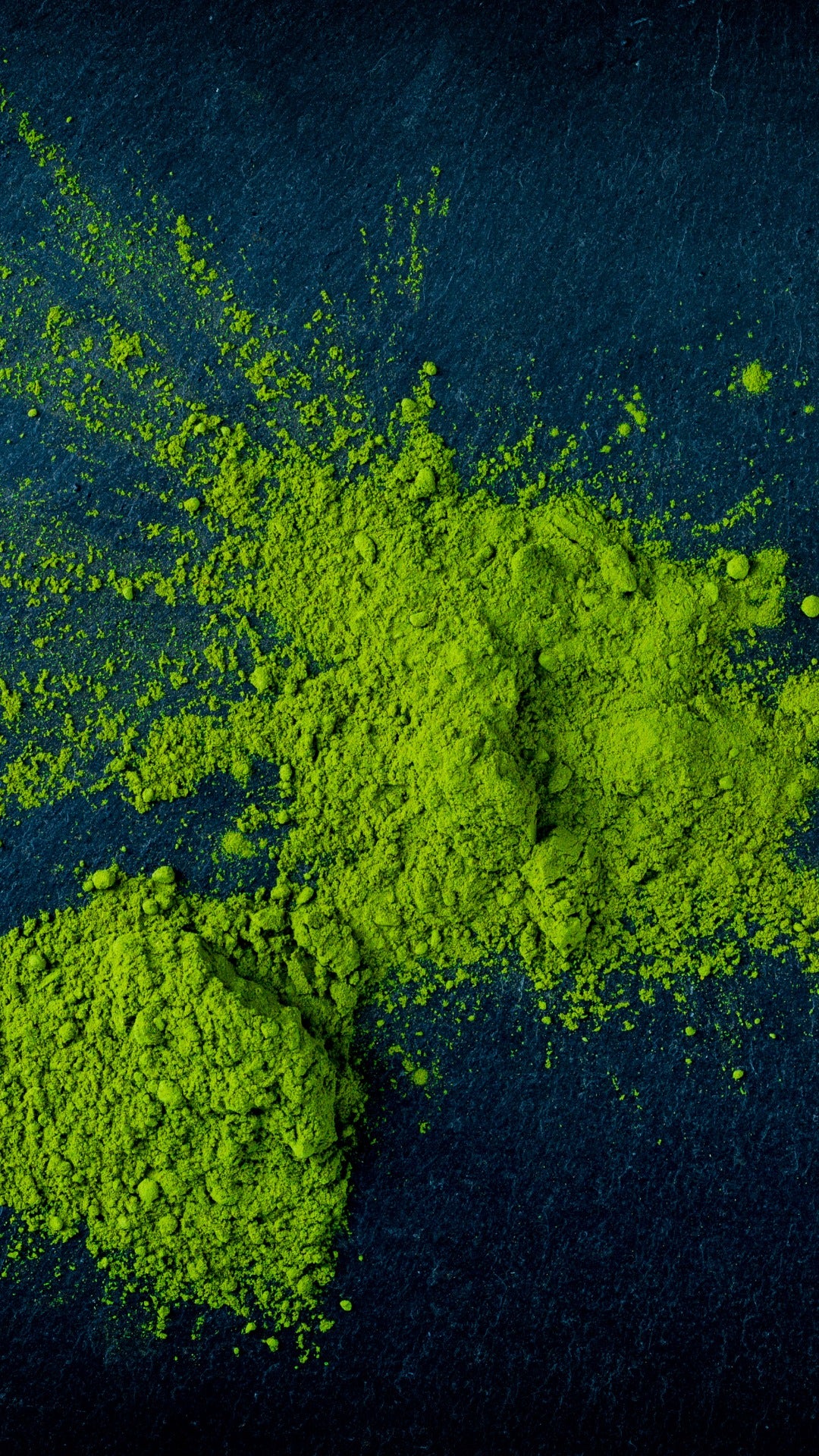 Matcha, green tea powder, high quality matcha powder, vibrant green, splashed, stone plate, dark background